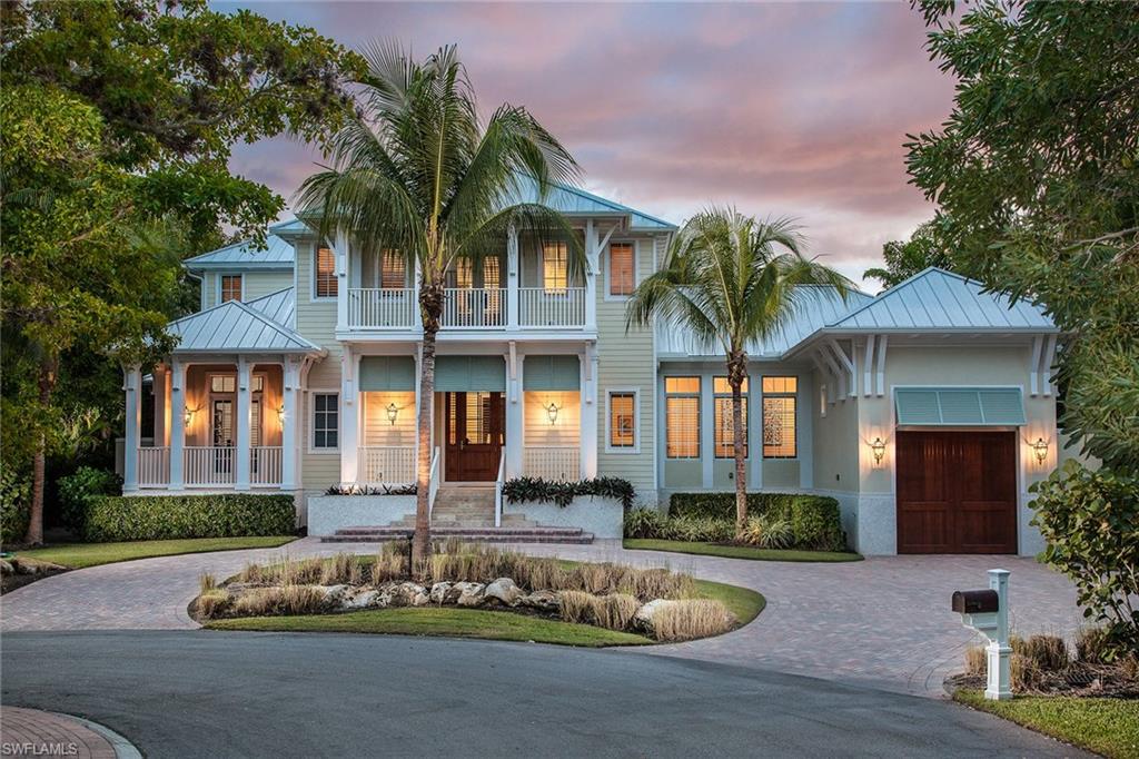 Charming 2011 Foresite-built Key West-style home. Situated on a cul-de-sac in Naples’ desirable Aqualane Shores, this home is stunning, private and serene. An open floor plan with transitional furnishings and coastal accents invites you in. Most furniture is included. Great room, dining room, kitchen, 10-foot sliders and expansive windows bring in nature’s beauty. Every design element enhances the blend of indoor-outdoor living. Magnificent wide plank floors, coffered ceilings, gourmet chef’s kitchen, custom white cabinetry, and expansive white marble Island await your culinary adventures. A spacious first-floor master suite, chandeliered bath, rain shower and imported stone floors offer a sense of a private spa. Three large en suite guest bedrooms upstairs and first-floor den or office and powder room, provide space for family and friends. Outdoor covered kitchen, dining area with fireplace and pool bath, flow to a private pool, spa and waterfall with southern sun. Garage space for three cars offers ample room for your active lifestyle. A private dock and lift, just steps from Naples Bay. Just moments to Third St. S or 21st Ave. beach. You must see this very private Naples gem!