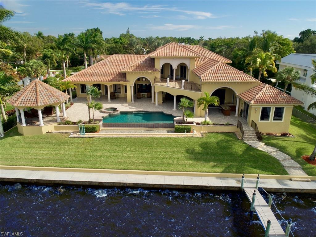 Over the top luxury w/ this exclusive Dan Sater designed SWFL waterfront estate...It’s all here to enjoy in this exciting five bedroom home with over 7000 ft.² of living sitting on 150 feet of frontage. Enjoy amazing water and sunset views from the outdoor entertainment areas, fantastic negative edge pool with spa, beautiful boat dock, outdoor kitchen, huge covered lanai w/fireplace, and separate outdoor covered gazebo area. Dramatic sophisticated elements are throughout this home. Soaring beam ceilings, incredible detail & craftsmanship, fantastic living areas are enjoyed all throughout, chefs kitchen, custom walk in wine cellar, billiards/media rooms, fireplace, elevator, library & den, exercise room, a very generous master retreat w/huge master walk-in closet and gorgeous bath area, full house generator, Lutron/Crestron electonic & audio system, extensive mill work/ ceiling & wall detail and precast concrete thru out and so much more. Explore a new level of luxury with this home located off majestic palm tree lined McGregor Blvd just steps from historic downtown Fort Myers, Edison-Ford Winter Estates, and more.