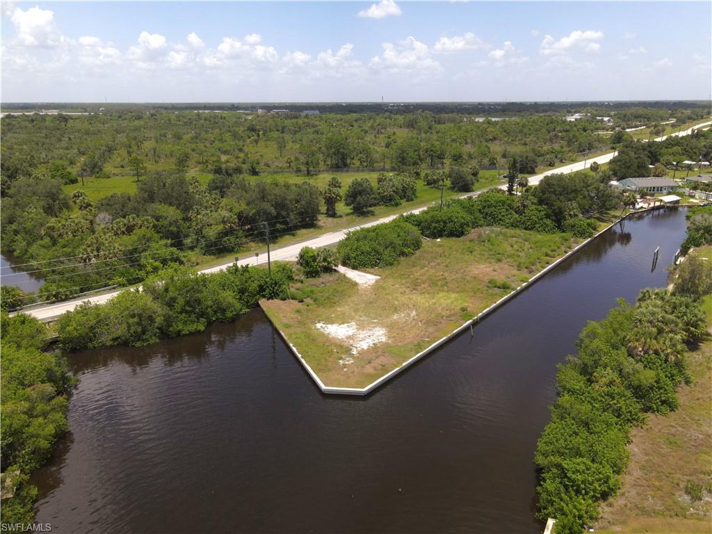 Rare 4-Lot Waterfront Estate on Intersecting Canals – Direct Access to Premier Waters:

A rare opportunity to secure an exceptional nearly ¾-acre waterfront estate lot positioned on intersecting canals just one block from the Peace River. This expansive, cleared homesite offers easy access to Charlotte Harbor and the Gulf—renowned for world-class fishing and breathtaking boating experiences. Bokeelia, Boca Grande, and Cayo Costa are just a few of the impressive places to navigate to.

With a seawall already in place, the property is perfectly suited for an impressive custom residence, complete with generous space for a substantial dock, boat lift, and elevated outdoor living design. The intersecting canals create a dramatic waterfront presence, offering expansive views and a commanding setting worthy of a luxury estate.

This is a premier canvas for an upscale waterfront build—combining size, location, and navigable water access in one of Port Charlotte’s most desirable boating corridors. A standout offering for buyers seeking a high-end coastal lifestyle with direct connection to some of Florida’s most coveted waterways. Paradise awaits!

Visit the property today! Realtors: bring your buyers!