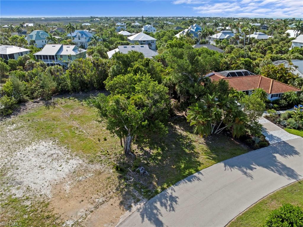 Build your dream island home on this exceptional vacant homesite located on a quiet cul-de-sac in one of Sanibel's most desirable neighborhoods. Situated within East Rocks, this lot offers a rare opportunity to create a custom residence in a peaceful setting surrounded by native vegetation and the natural beauty that makes Sanibel so special. Conveniently located near world-renowned beaches, bike paths, nature preserves, shopping, dining, and Sanibel's vibrant island amenities, this property provides the perfect balance of privacy and accessibility. Whether you're envisioning a seasonal retreat or a full-time residence, this prime homesite offers endless possibilities todesign and build the island home you've always imagined. Neighboring property located at 572 Chert Ct. is also available for purchase.