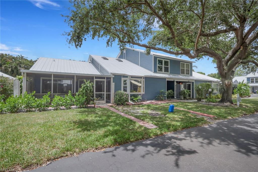 Welcome to this stunning, fully updated 3-bedroom, 3-bath home nestled in one of Naples' most convenient and sought-after locations. Thoughtfully designed for both comfort and style, this spacious home features two owner's suites, making it a perfect fit for families, multi-generational living, or hosting guests with ease and privacy. Step inside and you'll be greeted by a bright, open-concept layout that immediately feels like home. Featuring modern appliances and plenty of space for cooking, entertaining, and making memories. Tile flooring on the main level and cozy carpet upstairs create a comfortable, cohesive feel throughout every room. Peace of mind comes built-in with a brand new A/C (2025), a new metal roof, and new gutters already handled for you. When the day winds down, step out to your screened-in lanai and take in tranquil views of lush landscaping and mature trees that offer natural privacy and relaxation year-round. The location truly could not be better. Target, Publix, CVS, and everyday essentials are just steps away, while Naples' gorgeous beaches are only a 10-minute drive and the vibrant dining and shopping of 5th Avenue is just 15 minutes from your front door. Move-in ready and meticulously maintained, this home is the perfect blend of modern upgrades, unbeatable location, and everyday convenience.