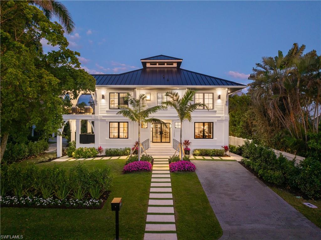 High and Dry – No Flooding from Storms! This stunning Olde Naples home has been completely transformed, with a total renovation completed in 2025, making it virtually brand new. Offering just under 3,000 sq. ft., 4 bedrooms, and 5.5 bathrooms, this home seamlessly blends modern luxury with timeless elegance. The open-concept design creates a perfect flow between living, dining, and kitchen spaces. The gourmet kitchen is a chef’s dream, featuring a Wolf 6-burner gas range, SubZero refrigerator, and SubZero wine cooler with a bottom refrigerator and ice drawer. Cristallo Quartzite countertops, a marble-wrapped island, and custom Crystal cabinetry elevate both style and function.The primary suite is a private retreat with vaulted ceilings, a sitting area, and pool views. The spa-inspired bath offers a Kohler soaking tub, a shower with body sprays and a rain shower head, and custom California Closets with integrated lighting.Step into the resort-style outdoor oasis, where a brand-new saltwater pool, integrated spa, and wading pool with a tranquil fountain create the ultimate escape. State-of-the-art Pentair equipment with a natural gas heater maintains perfect water temperature, all controlled from your mobile device. The fully equipped outdoor kitchen, complete with a grill, refrigerator, sink, and TV, is ideal for entertaining. Throughout the home, designer light fixtures from Visual Comfort and Ralph Lauren add warmth and sophistication, perfectly complementing the wide plank Legno Bastone French Oak flooring and Kohler plumbing fixtures. Smart home technology, including Control4 lighting, a full audio-video system, and exterior security cameras, enhances convenience and security. Impact windows and doors provide both style and protection. Located in the heart of Olde Naples, this home is just a short walk to Third Street South’s world-class dining and shopping, as well as the pristine beaches of the Gulf of Mexico. Offering an unbeatable location paired with luxurious finishes and modern conveniences, this move-in-ready masterpiece is the perfect Naples retreat.