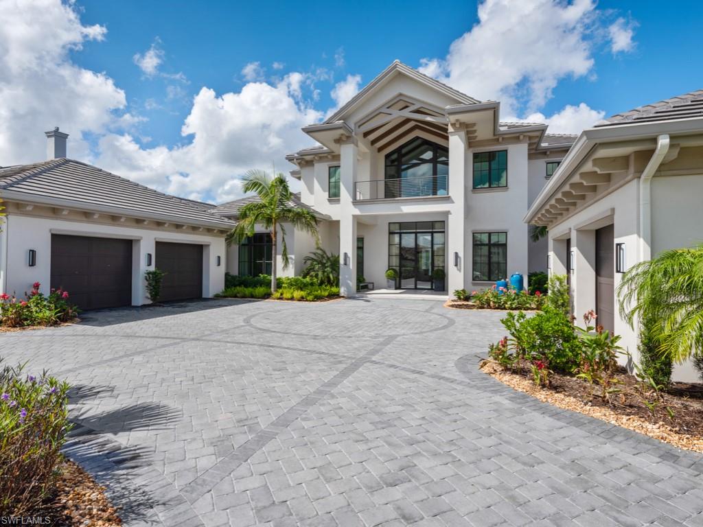 Sweeping western sunset views across the 700-acre freshwater lake, expansive outdoor living areas, and a club room and a game room are among the many highlights of this Grand Estate home located on Miromar Lakes’ white-sand beach in Lugano, an beachfront neighborhood of only 11 waterfront homes. The two-story home offers over 6300 square feet of air-conditioned living space and 10,680 total square feet offering four bedrooms, including a junior master suite; seven full and half bathrooms; as well as a study, elevator, attached two-car and a detached two-car garage. A private dock with boat lift is the perfect spot to watch the sunset over Lake Como.