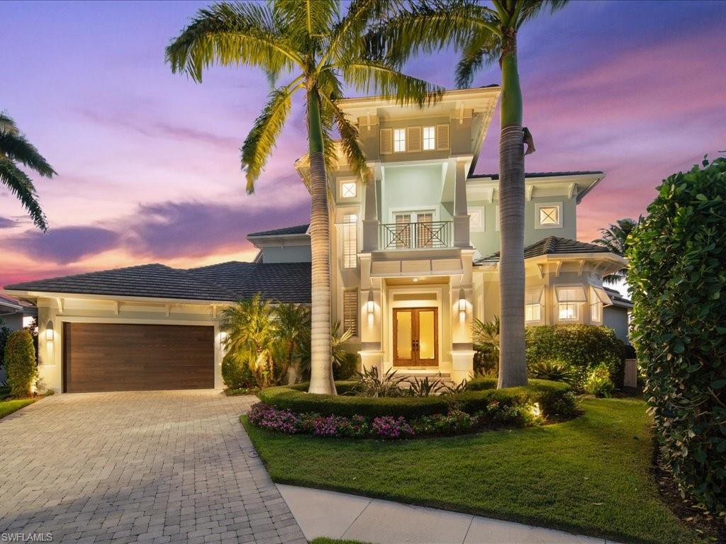 Stunning custom waterfront residence on sought-after Marco Island! Absolutely gorgeous Key West style 4 bedroom + den, 4 1/2 bath home is move-in ready. This vast 2 story home has split bedrooms and an open floor plan with endless upgrades and modern finishes. Master retreat features huge, walk-in closets, dual vanities, multiple showerheads, and private water closet. The gourmet kitchen boasts a double wall oven, gas cook-top and large island. Home is built for entertaining with expansive lanai/balcony, outdoor kitchen, and resort-style pool/spa overlooking the water! This tip-lot has a pristine IPA dock with boat lift and two JetSki lifts - a residence a boater's dream! Ideally located just minutes from the dining, shopping, and entertainment of Marco Beach.