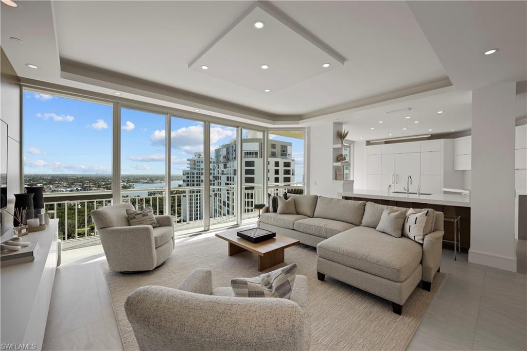 C12837 This rarely available turnkey furnished penthouse with sleek lines and minimalistic design is the epitome of contemporary luxury. Whether enjoying the sweeping views or entertaining guests in the state-of-the-art kitchen, this unit provides an unmatched living experience that is both luxurious and sophisticated. No detail was overlooked, from top-of-the-line appliances and fixtures to elegant finishes such as quartz countertops, remote shades, free-standing soak tub, custom closets, solid core doors, and custom cabinets. High ceilings and skylights provide natural light, and floor-to-ceiling windows offer unobstructed views of the bay and beach. This open and airy feel allows you and your guests to fully appreciate the beauty of the surrounding area. Two premium parking spaces on the enclosed lobby-level garage, and an additional storage locker, are included. Bay Shore Place offers 24/7 security and is pet friendly with two pets under 20 pounds. Just steps away from world-class dining, and shopping, and is the perfect location for those seeking a beachfront property that offers the ultimate in luxury living.