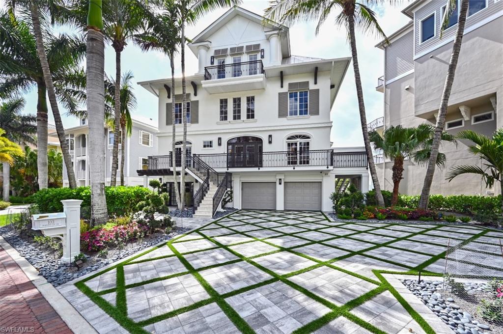 Beautiful updated 4 story Barefoot Beach home on the Gulf of Mexico with wide Beach views.