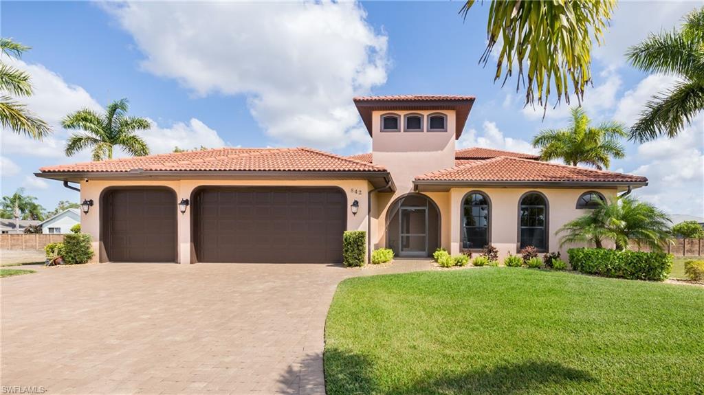All recently Remodeled Exquisite CUSTOM 2 Story Courtyard Home in a Gorgeous gated and golfing community of Palmetto Pines Estates.  4 HUGE bedrooms, 3.5 baths,  3 car garage.  One bedroom and F/Bath has its own private entrance off the Courtyard.  Another bonus room is on second floor - 2992 square feet under air!  Totally Remodeled with crown molding, gorgeous Travertine flooring, granite tops, new cabinetry and travertine in all showers throughout home.  All new plumb fixtures, appliances, lighting fixtures, custom new railing for staircase, new carpet in bonus room and master, window coverings, alarm system with cameras and ceiling fans were installed. The homes is like BRAND NEW!  Painted interior & exterior of house.  The sprinkler system was replaced and new sod & trees laid  decorative landscape curbing.  Installed new paver pool deck, lanai driveway & sidewalk.  So just move in and enjoy the privacy, as well as, security as you bask in the good life of your new found paradise.  Palmetto-Pine Country Club has been the staple of Cape Coral providing championship golf and a host of dining and social activities for its members and guests.