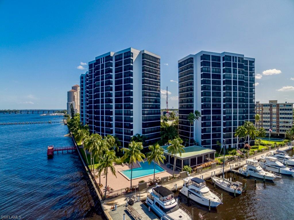 Spectacular River Frontage Sunsets can now be yours! Nestled on the Caloosahatchee River & walking distance to Downtown Fort Myers, this 15th floor "furnished" end unit condo offers unobstructed waterfront views unlike any other. With over 2,000 s/f of living space, this high-rise condo offers 2 bedrooms +Den & 2 full baths. Once a 3BR unit, the owner removed an interior wall to create an expanded open kitchen & sitting room both with waterfront views. As you walk into the unit from the foyer, stunning waterfront views lull you into a relaxed bliss! Tile & carpet run throughout the condo. Custom glass front door & designer etched wall mirrors create a feel of elegance. The kitchen was recently updated with high-end built-in cabinets, stainless steel appliances, Sub-Zero refrigerator, Bosch dishwasher, and pendant lighting. Additional  features include W/D laundry room with utility sink, electric hurricane shutters, new HVAC in 2020, and, an exterior storage unit just steps from the unit.  Great community amenities include tennis and pickelball, exercise room, social gathering room and kitchen, plus a fishing pier. Just steps from the Edison Ford Marina, you are now home!