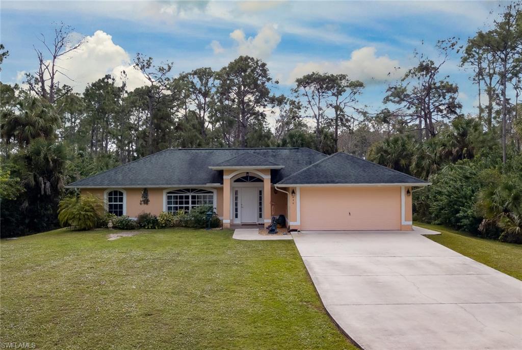 GREAT FAMILY HOME in Golden Gate Estates. Three (3) bedroom; two (2) baths; two (2) car attached AIR
CONDITIONED garage; on 1.59 acres, quiet neighborhood. Built in 2006 by owner. There is a 50' SCREENED IN
LANAI with a six (6) person covered HOT TUB. Master bedroom has FRENCH STYLE DOORS leading to screened lanai. The driveway is concrete, 200' LONG, which provides ample parking for larger vehicles or a boat. There is a 14' x 24' OUT BUILDING which can be used for lawn and garden equipment or a small business/ work shop.
There is a BUILT IN WHOLE HOUSE GENERATOR with a 250 gal propane in-ground tank. There is an OUTDOOR enclosed SHOWER off screened lanai. The owner will leave all lawn and garden equipment, gun locker and safe, and alarm system. BTW, Home comes with a ONE YEAR HOME-TECH WARRANTY.