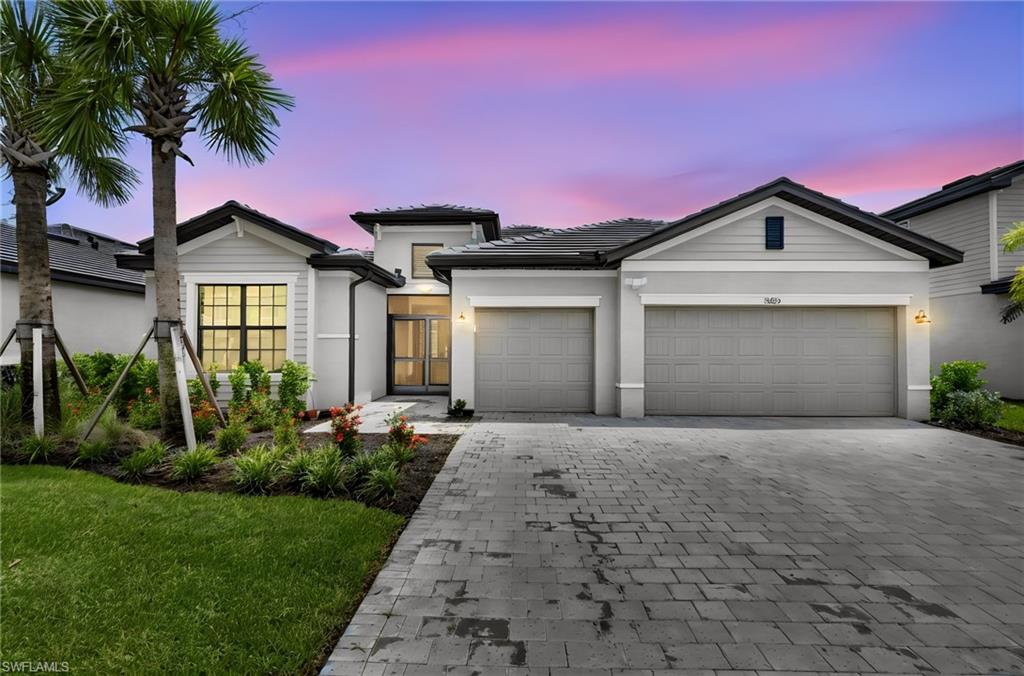 Modern Elegance! An opportunity to own in this sought after community of Timber Creek. Enter through double doors with added screen enclosure into foyer.  Built in 2025, this Summerville II, lakefront home is upgraded with an expansive extended screened-in lanai, stylish window treatments, light fixtures and fans.  Designed both for comfort and style, this spacious residence features a desirable split floor plan that provides privacy for family and guests, along with a separate office/den that's perfect for working from home or creating a quiet retreat. The open concept living areas are enhanced by elegant porcelain tile flooring throughout, creating a seamless and sophisticated look. The gourmet kitchen with quartz countertops and glass backsplash, stainless steel appliances and abundant cabinetry, flows effortlessly into living and dining spaces, making it ideal for everyday living and entertaining. Relax and enjoy breathtaking water, and sunset views while embracing the Florida Lifestyle. Whether you are sipping coffee or hosting evening gatherings,  this outdoor living space is sure to become a favorite. Additional premium features include a 3 car garage and custom window treatments throughout the home. Several windows are equipped with blackout blinds. For added convenience, comfort and privacy, the master bedroom and living room blackout blinds blinds are electric. Residents of Timber Creek enjoy security of a gated community along with an array of resort-style amenities making this an exceptional lakefront property! The perfect pace to call home! Amenities include 3 pools, exercise room, a restaurant, gym, kids play area, tennis and pickleball.