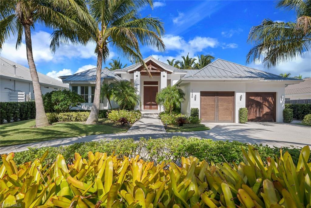 BREATHTAKING HOME BY SOURCE CONSTRUCTION! Absolutely gorgeous 3 bedroom, 3 1/2 bath home is move-in ready. This one of a kind home has split bedrooms and an open floor plan with endless upgrades. Master retreat features huge, dual walk-in closets, dual vanities, soaking tub, large shower with seat and drying area and private water closet. The gourmet kitchen boasts a double wall oven, cook-top with hood and large island. Home is built for entertaining with complete outdoor kitchen and stunning pool/spa complete with new dock and 16,000 lb boat lift!