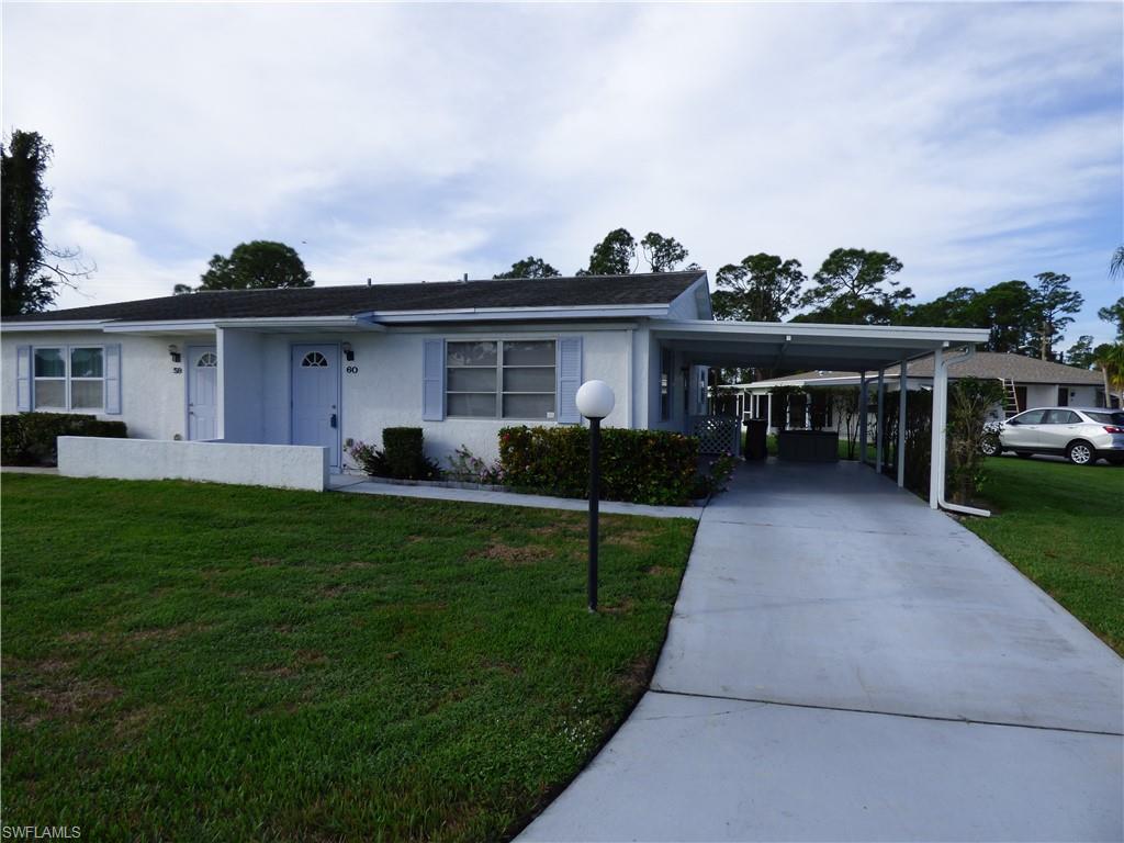 Two bedroom two bath villa with carport in Pinewood condominiums, stucco exterior, covered carport parking, corner end unit with open park like setting in the rear, luxury wood plank vinyl throughout the entire condo, walk in closet, eat in kitchen, tile in shower and baths, indoor laundry area, latest phase of Pinewood with neutral colors throughout, 55+ community, pets OK, walking distance to stores etc, quiet well maintained community with low monthly maintenance fees that includes the roof.