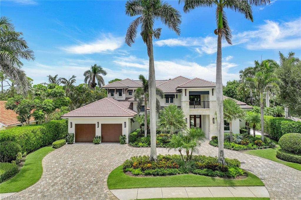 Luxurious Park Shore Living Awaits You! 
Welcome to 569 Neapolitan Way, a meticulously designed and recently updated masterpiece nestled in the highly sought-after Park Shore community of Naples, Florida. This stunning stucco home, built in 2015 and updated to perfection, offers a seamless blend of modern luxury and timeless charm.  Experience the grandeur of soaring ceilings and an open-concept layout, making it perfect for both entertaining and daily living.The custom gourmet kitchen is a chef's dream, featuring top-of-the-line appliances, a walk-in pantry, and a wet bar.Retreat to your private oasis in the posh master suite, complete with his/her water closets, heated towel bar, walk-in shower, and a dual vanity, all adorned with exquisite porcelain floors. The den is equipped with a cutting-edge home automation system, making your life easier and more convenient.  Enjoy a spacious great room and family room, as well as an outdoor kitchen with a gas fireplace. Take a dip in the saltwater pool with a spa, surrounded by professionally landscaped grounds.  Enjoy a spacious great room and family room, as well as an outdoor kitchen with a gas fireplace.