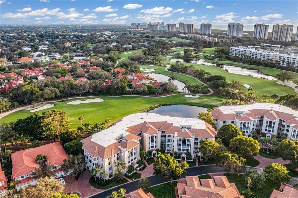 C9011 - This rare Crescent Penthouse offering is the quintessence of luxury living in Pelican Bay! From the moment of entry into your private vestibule, you are greeted by stunning long-range golf course views and the coastline for those who desire limitless horizons. The sunlit great room, dining room, custom library, exceptional master suite, and a sitting room with dual baths, along with the spacious beachfront lanais, all enjoy stunning sunsets. In addition, the "chef’s delight" kitchen, butler's pantry, morning room, and family room with fireplace are all enhanced by the delightful Pelican Bay views. Residents of Pelican Bay enjoy exclusive amenities, including two private beach clubs and restaurants, two tennis complexes, and a community center with a wellness center. Private transportation to the beach clubs is also provided via tram, creating the ultimate lifestyle combining elegance, privacy, and beautiful stretches of white sand.