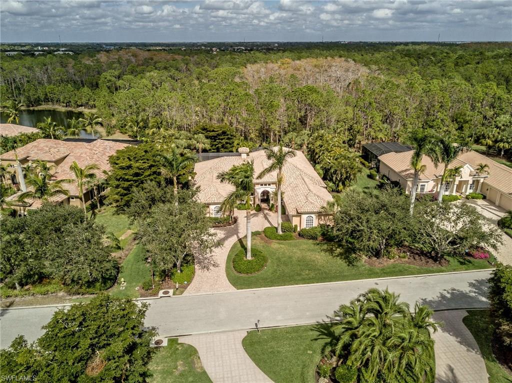 Pure serenity and privacy perfectly describes this home! This stunning 3 bedroom plus den home is like no other in Shadow Wood. The spacious lanai offers complete privacy, spacious lanai and backyard, 30ft lap pool with spa, summer kitchen and firepit which 90 degree pocketing sliding doors seamlessly transition into the family room. Large windows throughout the home including five 10ft windows in the entry area allow tons of natural light to come into the home. You will love the den which overlooks the lanai and pool with natural gas fireplace. There is NATURAL GAS throughout the home! Gorgeous ceiling detail in every room including; coffered and tray ceilings and crown molding. Additional standout features include 775 bottle temperature control wine room, wet bar, his her California closets, spacious kitchen with 3 ovens, walk in pantry and center island and much more! Shadow Wood CC has 3 championship golf courses, 9 Har Tru tennis courts, 2 club houses, bocce, pickle ball, access to private beach club, fitness center, full service spa and much, much more!