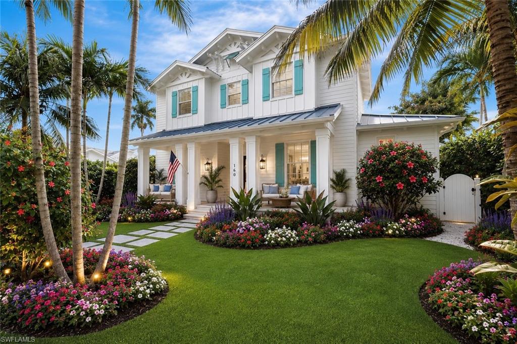 One or more photo(s) has been virtually staged, AI generated or rendered.  Set just steps from the Gulf and the celebrated boutiques and restaurants of Third Street South and Fifth Avenue South, this extraordinary newly built estate embodies the pinnacle of refined Old Naples living. Crafted in 2017, this gorgeously furnished four-bedroom + den residence offers an exceptional blend of timeless coastal elegance and modern luxury across an impeccably curated floor plan.

From the moment you enter, the home captivates with soaring ceilings, wide-plank French oak flooring, bespoke millwork and designer lighting that create an atmosphere of understated sophistication. Walls of glass fill the interior with natural light, while seamless indoor-outdoor transitions invite effortless entertaining and relaxed resort-style living.

At the heart of the home, the spectacular chef’s kitchen is a true statement of luxury and design, featuring an oversized island, a commanding 48-inch Wolf gas range, dual Sub-Zero refrigeration, Miele built in wine refrigerator, Miele built-in coffee system, premium fixtures and custom cabinetry tailored for both grand-scale entertaining and everyday comfort. Adjacent living and dining spaces are anchored by a beautiful private tropical retreat where every detail has been thoughtfully considered. The outdoor Oasis features a stunning custom pool and spa with oversized sun shelf, towering private bamboo hedge, and outdoor kitchen, creating an atmosphere reminiscent of an exclusive luxury resort.

The first-floor primary suite is a serene sanctuary, offering spa-like amenities, a luxurious bath retreat and a custom walk-in wardrobe. 

A private detached cabana guest suite on the main level provides exceptional comfort and privacy for visitors.

Accessible by both a private spacious elevator and staircase, the second level is designed for elevated entertaining and relaxed living alike. A comfortable loft serves as a central gathering space surrounded by 3 beautifully appointed en-suite guest bedrooms.

Additional features include impact-resistant doors and windows, whole-house 20- kilowatt generator and the highest level of craftsmanship and finishes throughout.

An exceptionally rare offering in one of Naples’ most prestigious locations, this remarkable estate delivers unparalleled luxury, timeless architecture and the ultimate Olde Naples lifestyle just steps from the beach and world-class dining and shopping. This home offers you the convenience of living a life of walking to the beach every day, dining on Third Street, and enjoying the newly opened Olde Naples Hotel which offers a bar for an evening beverage after you enjoy the beautiful Naples sunsets.