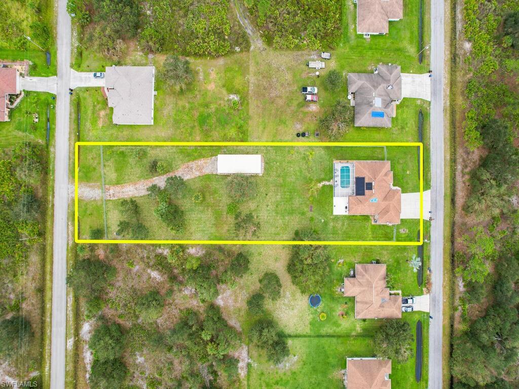 Pending but continuing to show and take backup offers until contingencies clear.

UNIQUE OPPORTUNITY - meticulously cared for & updated home on DOUBLE LOT w/ RV carport & more!
This home is STORM READY w/ 20 KW Kohler whole house generator that features an automatic transfer switch (transferable warranty) and owned buried 500 gallon propane tank for generator (It ran for 2 days after hurricane before power was restored and only used 3% of fuel. During outage I  was using AC, pool pump, etc. - so I could have gone for weeks!), plus Eurex installed accordion hurricane shutters on all windows & on the Lanai enclosure.
Recent updates include new pool solar heater w/ 7 new Heliocoil solar heat panels (Advanced Solar and Pool installed) and the roof is currently being done by Affordable roofing out of Cape Coral w/ a transferable warranty. You will love the space this home offers both on the interior of the home and on the fully fenced-in backyard with stretched all the way to the next block. Very diverse property with dual entry, RV carport in backyard, single family pool home w/ great room layout, screened pool lanai, large open lanai, and wide drive in front of home leading to a 3-car garage. Great location- easy access to Fort Myers & I-75!