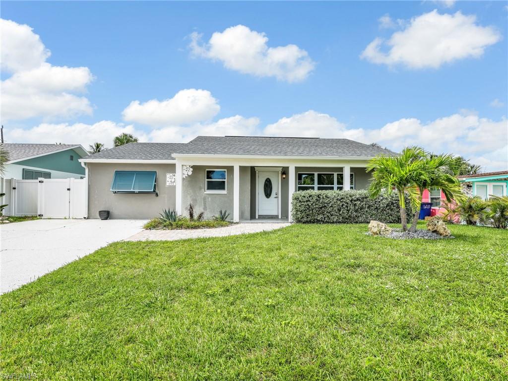This beautifully remodeled single-family home is located Mid-Island on Fort Myers Beach, just steps from the bay and a private community fishing pier. Offering 3 bedrooms, 2 bathrooms, this coastal retreat is filled with natural light and modern upgrades throughout. The new kitchen features stainless steel appliances, quartz countertops, white shaker cabinets, a center island, and a spacious dining area. The master suite includes a walk-in closet, double vanity, and walk-in shower, while additional highlights include vinyl flooring throughout, impact windows and doors, a tankless Insta-hot water heater, newer roof, recessed lighting, and an inside laundry room. Outdoor living is a dream with an oversized screened lanai with no-see-um screening, an open-air paver patio, an oversized spa, a fully fenced yard, and plenty of room for a pool. With ample parking and a prime location within walking or biking distance to beach access across Estero Blvd and Publix grocery store, this home is move-in ready and offered turnkey.