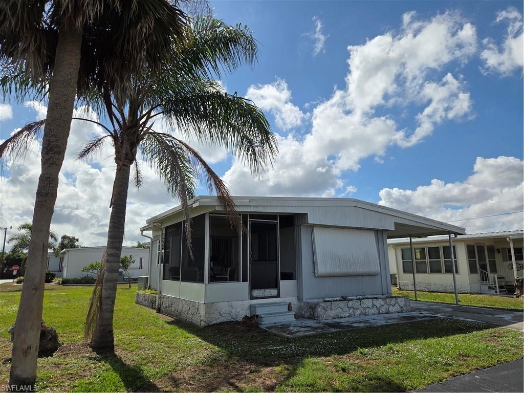 AFFORDABLE LIVING! Check out this Excellent VALUE in LAZY DAYS where you OWN YOUR LAND & enjoy the tropical lifestyle of Florida! This FURNISHED single-wide with a sunny Florida room is Move-In Ready & Priced to Sell! Ideally located on a quiet street near the heated community pool & recreation center. You'll love the Bright & Cheery eat-in kitchen with breakfast bar & laminate floor. Lots of natural light throughout. New carpet in living room and bedrooms; ample storage; awnings for weather protection & energy savings.  Enjoy the good life with a LOW monthly fee of only $185! Own this unit AND your LAND! This cute & cozy home is ready for your final decorating touches! Washer/dryer conveniently located in the shed. Walk to the pool & enjoy a friendly 55+ Community with 2 clubhouses, heated pool, shuffleboard, ponds, parks, mature landscaping, street lights. Low-cost RV & boat storage available on-site! Life is good at Lazy Days! A great place to live year-round or as a 2nd home for warm weather enjoyment!