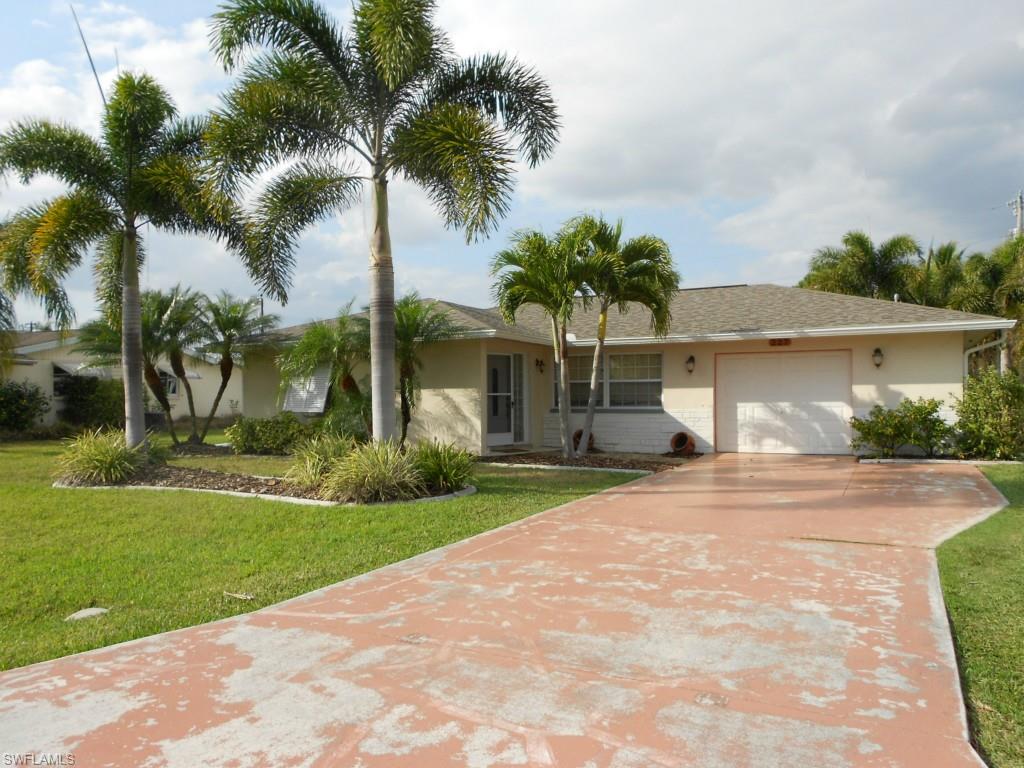 Here is your chance to own a 2 bedroom, 2 bath, pool home in the desirable SE Cape with all assessments paid. This home is in move in condition. It has a brand new roof and new landscaping. The kitchen has been upgraded with granite, stainless steel appliances, laminate and tile floors through out, and a central vac system.  There is a room that can be used as a office. You have french doors that go out to your screened in pool area. You can enjoy the large backyard with sitting area around the fire pit. MUST SEE!