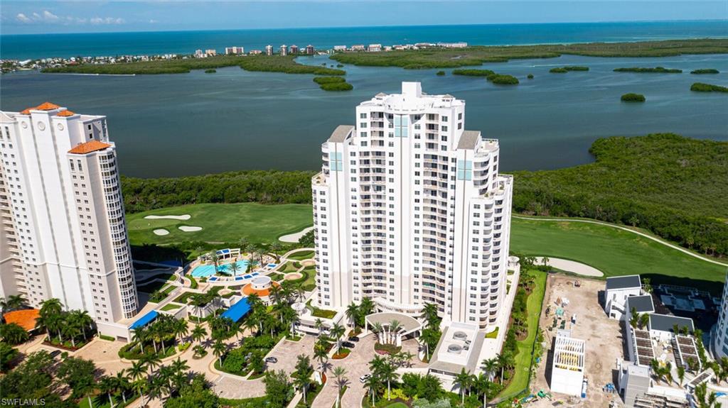 C6136- Sold turnkey furnished including designer décor, furniture, artwork, linens and kitchenware. Spacious 20' x 21’7 living room with large built-in flatscreen tv and linear fireplace. Lovely owners’ suite overlooking the water, with 2 walk-in closets, custom bath finishes and high-end spa/tub. All three bedrooms open onto terraces. Roomy guest bedrooms on opposite wing offer extra privacy, both guest bedrooms with ensuite baths and walk-in closets. If desired den can be used as 4th bedroom with adjacent bath. Private elevator foyer. Very spacious 14’6” x 22’ screened lanai with built-in gas grill. Wide, west facing sunset views over the water. 2 assigned under building parking spaces, plus storage unit. Sophisticated lighting fixtures, elegant wall finishes and window coverings. Built in 2018, Seaglass offers 24-hour front desk, rooftop deck/entertaining area, resort pool and spa, billiards room, fitness room, social room, meeting room and movie theater. Bonita Bay has beach park on the Gulf, 12 miles of walking trails, 380 boat full service marina, five golf courses, ten pickleball courts, 18 tennis courts, bocce ball pavilion and huge fitness/spa/salon facility.