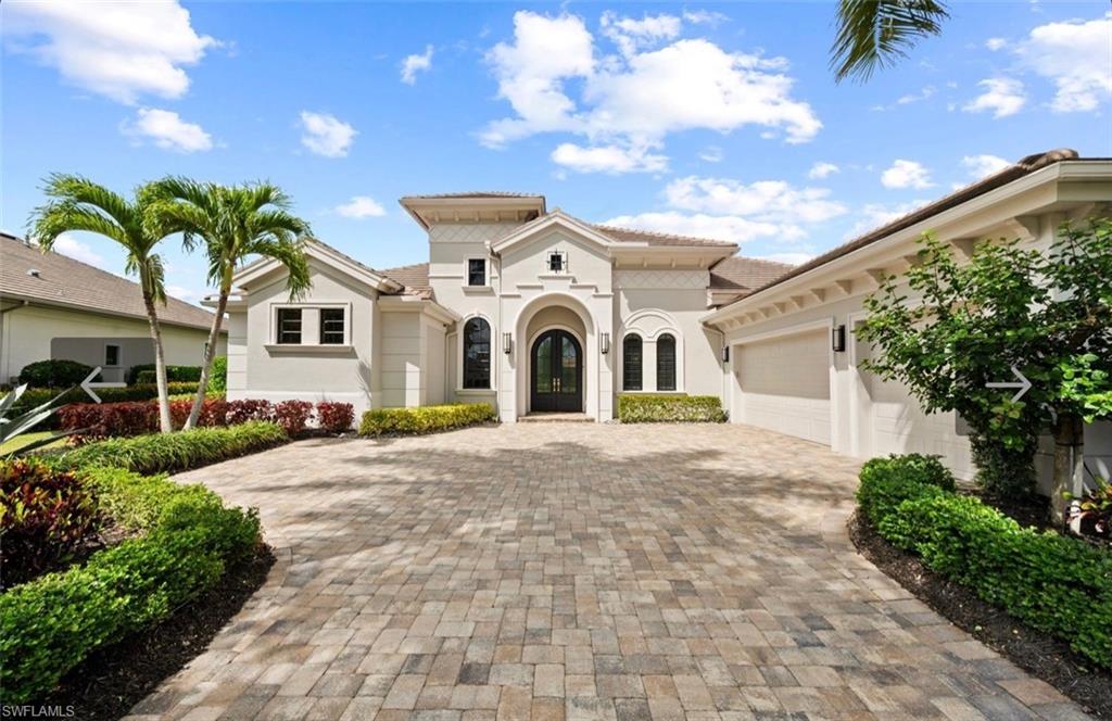 GOLF IMMEDIATELY AVAILABLE!  Exquisite in every dimension, this remarkable home stands as a showcase of refined luxuary, capturing sweeping vistas of the 16th hole of the Lakes course and shimmering lake beyond.  Curated with meticulous attention and maintained to perfection, every detail reflects elevated design. From the moment you enter through double glass-inlaid doors the interior will captivate with luminous porcelain floors and custom millworker. Designed for effortless entertaining as well as everyday living, this home offers a harmonious blend of formal and informal spaces while indoor and outdoor living merge seamlessly via opening corner sliders. The spectacular lanai features a fully equipped outdoor kitchen and island, panoramic screens, a welcoming gathering space enhanced by warm wood accents and coffered ceilings and a resort-style custom-designed pool featuring a cascading waterfall and integrated spa. The primary suite serves as a private sanctuary featuring a tranquil sitting area and spa-inspired bath with soaking tub, dual rain showers, dual vanities, and a secluded water closet.  Some of the many upgrades include: whole home generator, impact glass, impact garage door, hurricane shutters, new garage flooring,  garage storage units, interior and exterior painting, HVAC in 2022, dishwasher in 2025, washing machine 2025, and Sonos sound system.  More than a residence, this is a statement of elegance, craftsmanship, and a lifestyle defined by uncompromising quality.