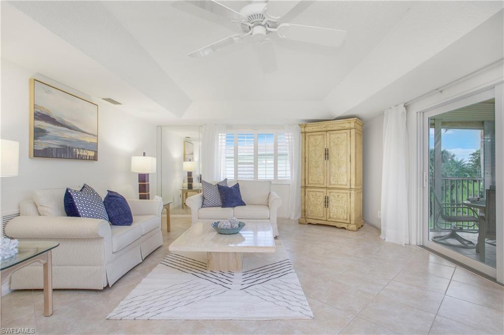 This immaculate condo in Naples offers a lifestyle of utmost comfort. With a plethora of desirable features, this property is sure to impress even the most discerning buyer. Step inside and see the updated tile floors and the abundance of natural light that floods the living area, creating an inviting atmosphere that is ideal for relaxation. The large, hurricane impact sliders, offer peace of mind and also beckon you to bask in the Florida sunshine.  The western facing view means you can enjoy endless sunsets while overlooking the 17th hole of the Glades golf course. The split floor plan offers privacy and comfort. The roof, replaced in 2017, further enhances the property's value. This condo boasts the best view in The Glades. This community offers tennis and pickleball courts, shuffleboard, bocce, 2 golf courses. and 9 pools. The library and main club house are just steps away from your door. Don't miss the opportunity to make this move-in ready condo yours!
