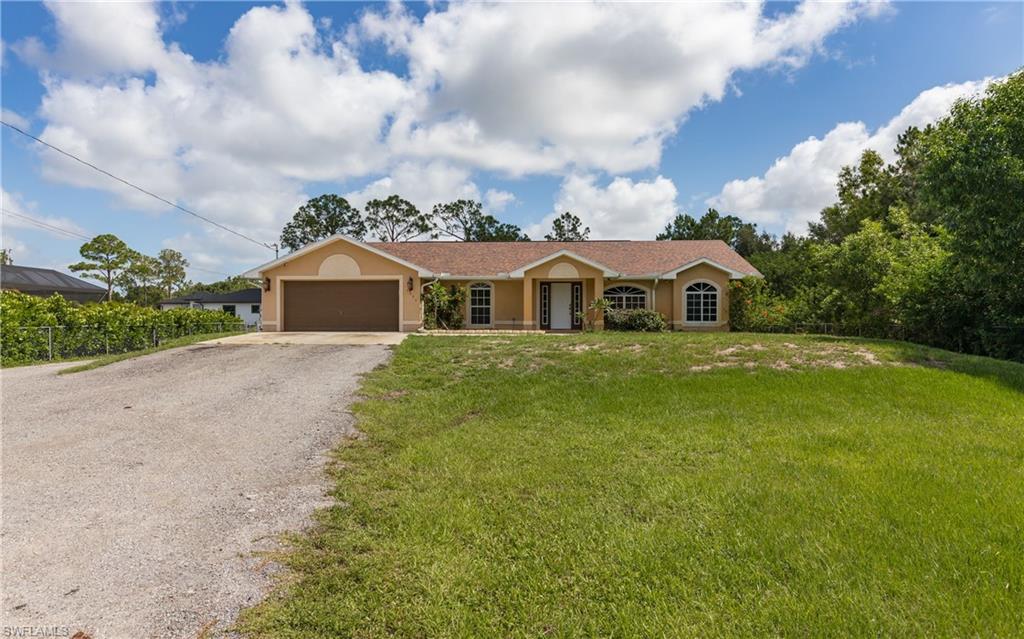 This property offers a private setting in Golden Gate Estates, Naples. With 1.59 acres, you have plenty of room to build a shed, workshop, or whatever your heart desires, offering endless opportunities for customization and expansion to suit your lifestyle.
The home has been professionally cleaned and features over 1,700 square feet of living space with three bedrooms and a den, providing comfortable accommodations for any size family. The kitchen is outfitted with stainless steel appliances, delivering both durability and a contemporary look that enhances daily living.
Significant upgrades include a complete Reverse Osmosis (RO) system for whole-home purified water, ensuring fresh and clean water for drinking, cooking, and more. Additionally, the roof was replaced after Hurricane Irma, offering enhanced protection and longevity against the elements.
Security meets convenience at the front with an electronic gate featuring code access, allowing for quick and secure entry. A paved road runs all the way down the property, enabling you to establish a parking area all the way in the back where larger trucks and vehicles can be stored out of the way, preserving the aesthetic appeal of the front yard.
There’s also an outdoor shed in the front, which serves as a nice place to keep your lawnmower, boat, or other equipment neatly stored and accessible. In the middle of the property, two large chicken coops are hidden nicely within the trees and separately fenced off, providing a discreet and organized space for your avian friends or additional storage needs.
This property in Golden Gate Estates combines the comforts of a spacious home with the freedom of ample land and practical outdoor features. Whether you’re a family looking for room to grow, an enthusiast needing space for vehicles and hobbies, or someone who appreciates privacy and self-sufficiency, this retreat has it all. Experience the best of Naples living in this private setting.