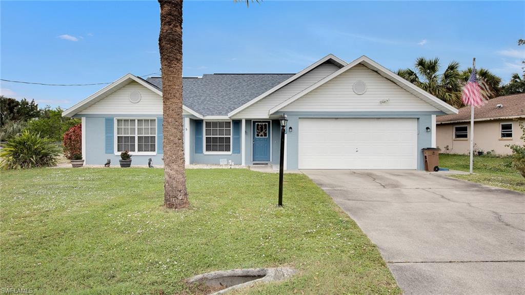 This is an immaculate one owner home located in Fort Myers Shores and sells with extra lot beside. Lot 10 at 14010 Saint Kitts sells with. THIS PROPERTY WAS NOT IN A FLOOD HAZZARD ZONE and received no damage or flood water anwhere close to the home from hurricane Ian. NEW FEMA FLOOD MAPPING NOW INCORPORATES THIS LOCATION AS AE-EL9. WE HAVE ELEVATION CERT THAT SHOWS THE FF OF HOME AT EL 10.0 THE OWNER HAS A FLOOD POLICY THAT IS ASSUMABLE AT A VERY LOW RATE. Property borders a small lake/pond in the rear and offers privacy as well as view of exotic birds visiting. The extra lot offers a great deal of flexibility and additional privacy.....plenty room for a pool and additional garage building.  This home looks as good as it did when new 28 years ago. The current owners have kept up with all maintenance as required. This is a CCB/stucco home and has hurricane shutters on all openings. The roof was replaced in 2018, A/C replaced in 2010, water heater in 2014....portable generator and transfer switch stays with the home