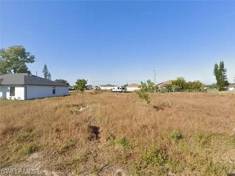 Excellent opportunity to own a residential lot in the growing NW Cape Coral area! Priced aggressively for a quick sale, this property is perfect for investors or future homeowners looking to build in a rapidly developing neighborhood. Conveniently located near schools, shopping, dining, and main roads with easy access to Fort Myers. No HOA. Well and septic area. Don’t miss this chance to secure land at a great value in one of Cape Coral’s fastest-growing areas!