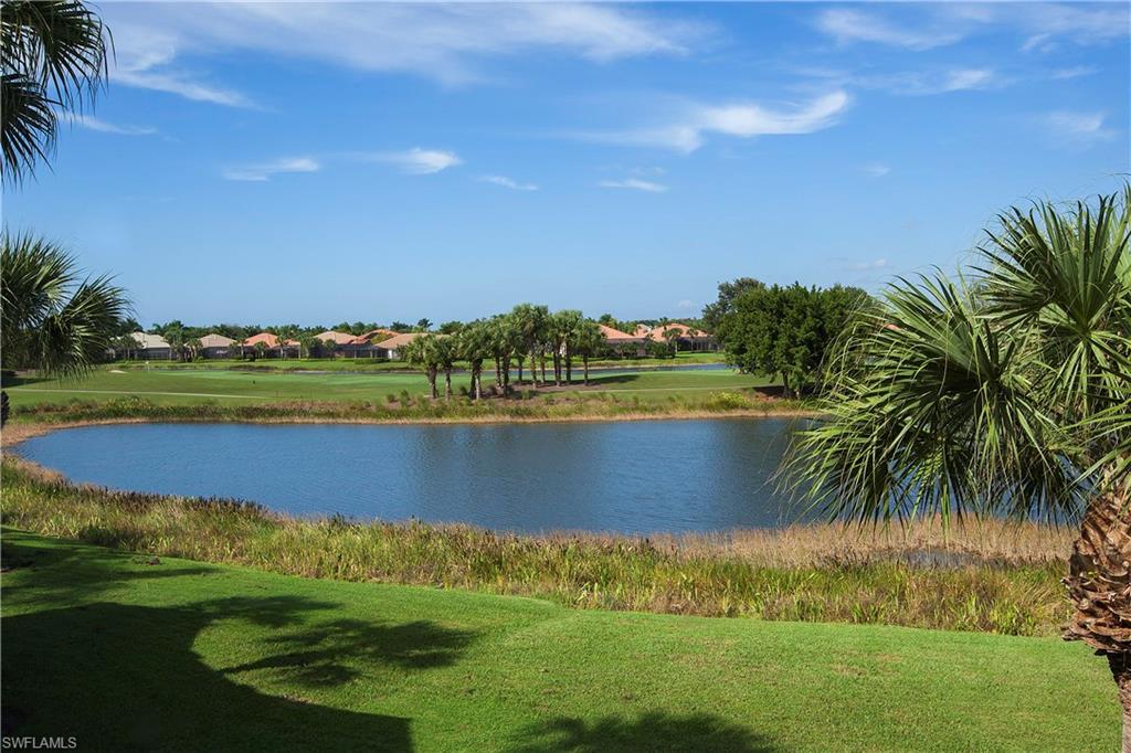 Spacious second-floor unit with elevator and mile-long lake-to-golf-to-lake view of the 15th fairway of Shadows North Course. This lovely Dorchester great room plan with 2,748 square feet lives like a single-family home with three bedrooms, three baths, den or office, oversized two-car garage and that sought-after bonus room that can be an exercise room, hobby room or second den. This unit, just across the street from the pool, features tile in all living areas, tray ceilings, island in the kitchen, 42 cabinets in the kitchen with glass display cabinets, ELEVATOR, custom wood bar and entertainment area, plantation shutters, electric shutters, and intercom system.  Shadow Wood offers 54 holes of private golf membership, private beach club, Rosie Spoonbill's, fitness facility, tennis courts and an active lifestyle. Start living life this season by just turning the key and personalizing your home with your own decorative touches.