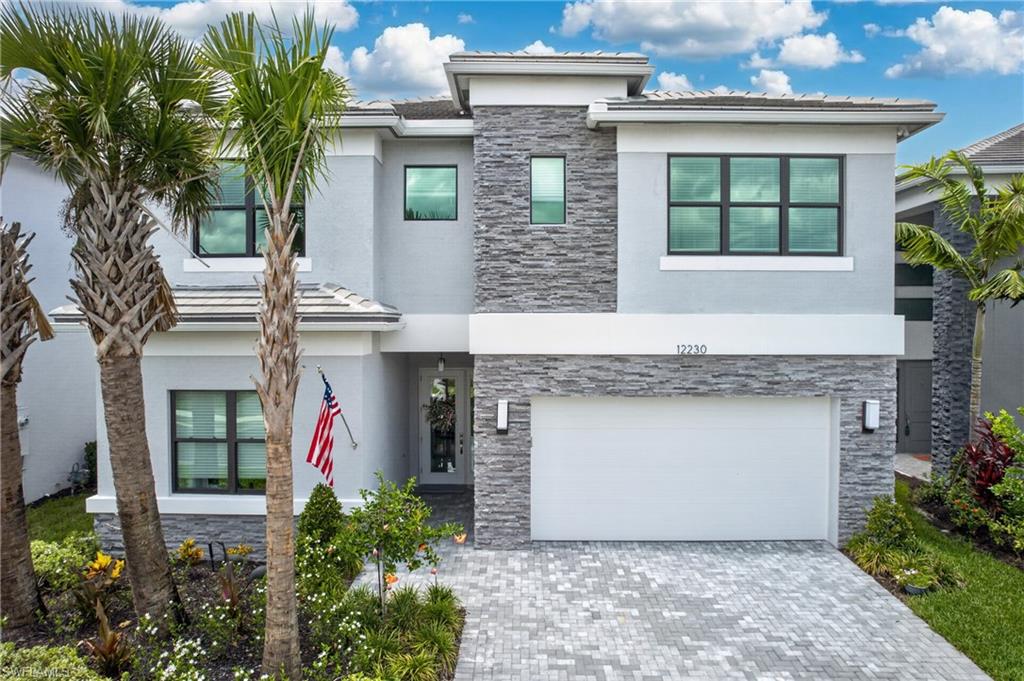 RiverCreek community of Estero. Situated on a premium lakefront homesite, this move-in-ready contemporary residence showcases over $150,000 in custom upgrades and offers the perfect blend of luxury, style, and functionality.

Featuring four bedrooms, four full bathrooms, and a spacious upstairs loft, this home boasts an expansive open-concept floor plan designed for modern living and entertaining. The designer kitchen has been extensively upgraded with custom cabinetry, premium appliances, and high-end finishes, while upgraded flooring, custom lighting, and elegant details flow throughout the entire home. The stunning great room is highlighted by a custom feature wall with stone accents, built-in shelving, and integrated media space, creating a true centerpiece for the home.

The luxurious primary suite and all guest bathrooms have been enhanced with upgraded finishes and fixtures, while the custom staircase banister adds an impressive architectural touch. Additional upgrades include built-ins in the loft and guest bedroom, a dedicated laundry room and an oversized two-car garage with an epoxy-coated floor.

Step outside to enjoy breathtaking lake views from the screened lanai featuring paver decking and a fully equipped outdoor kitchen—perfect for entertaining guests or enjoying Southwest Florida’s year-round outdoor lifestyle.

RiverCreek residents enjoy an exceptional resort-style lifestyle with world-class amenities including a clubhouse, community center, resort pool, fitness center, tennis courts, pickleball courts, bocce, basketball courts, playground, barbecue and picnic areas, business center, and miles of walking, jogging, and biking paths. Ideally located in the heart of Estero, you’re just minutes from Coconut Point, Miromar Outlets, Publix, I-75, Southwest Florida International Airport, and some of Southwest Florida’s finest dining, shopping, and entertainment.

Luxury, location, and lifestyle come together at 12230 Red Pine Place—a truly exceptional lakefront opportunity in one of Estero’s premier gated communities.