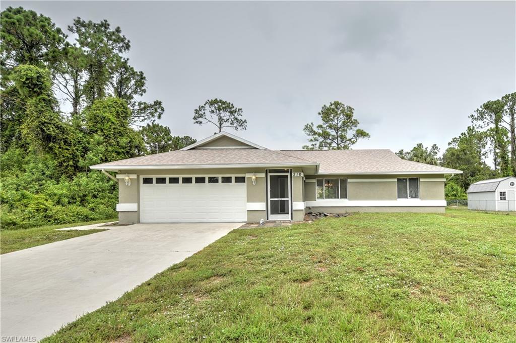 NEW ROOF, NEW AC in this well maintained 3 bedrooms, 2 full bathroom, 2 car garage CBS home in the heart of Lehigh Acres.  Updated kitchen cabinets with granite counter tops, tile and laminate flooring throughout the entire interior, updated bathrooms, vaulted ceilings in living areas, new light fixtures and hardware through out, and fresh interior and exterior paint.  Septic/well. Septic was pumped out 11/22.