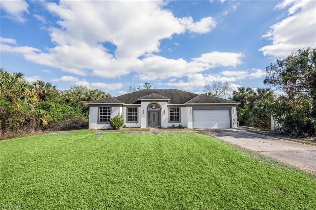 Tucked away on 2.81 acres in one of northeast Naples' most desirable areas, this hidden gem boasts an inviting and well-crafted single-level residence designed for space and comfort. Featuring 4 bedrooms, 3 bathrooms, a family room, and dining room perfect for gatherings, the layout provides the ideal balance of relaxation and entertainment. The remodeled kitchen seamlessly connects to the living area and opens to a screened-in lanai, providing a serene setting to enjoy the peaceful surroundings. An attached 2-car garage adds convenience to daily living. Positioned on a quiet street and set back from the road, this home offers a tranquil retreat while remaining close to shopping, dining, schools, and parks. The expansive lot presents endless possibilities, whether you envision lush gardens, recreational spaces, or additional structures.  Located less than 2 miles from the Big Corkscrew Island Regional Park, you'll have access to a wide range of recreational activities and amenities. Nearby attractions include the CREW Bird Rookery, where you'll enjoy access to 12 miles of walking and biking trails, Collier County Fairgrounds, and Saddlebrook Lakes, renowned for its upscale residences.  With exciting infrastructure enhancements, top-rated schools, and a vibrant growing community, this property offers an exceptional opportunity to invest in one of northeast Naples' most promising locations.