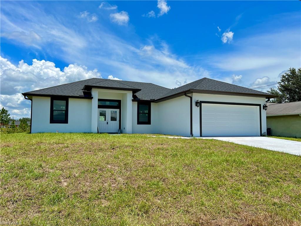 You have to see this gorgeous brand new construction home that is ready to purchase RIGHT NOW! Why wait 8-12 months for your brand new home when you can close it in around 30 days! The split open concept floor plan features 3 beds, 2 baths & an enclosed den with 1,600 sq ft of living area. Inside you will see stunning large format tile throughout the entire home, white shaker cabinets with slow close hinges, a kitchen pantry, beautiful granite counters and stainless steel appliances being installed before closing! The master bathroom is worth it all by itself with dual sinks, large walk in shower, 2 walk in closets & an enclosed toilet area!. Features a laundry room with access to the garage & the rear lanai is spacious and comes with tile flooring installed for easy cleaning. The entire home is surrounded by hurricane impact glass for the windows, doors & sliders! Located on a dead end road in a highly sought after neighborhood of Lehigh which is a stones throw from elementary/middle/high schools as well as the library and only a few minutes drive to Fort Myers! Take advantage of this rare opportunity and snag this brand new home before someone else does!