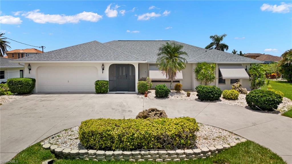 Prime Waterfront Living Opportunity at Cape Coral Yacht Club on Coral Drive! Experience endless water views down the majestic 240ft wide canal, offered at a price that's near lot value. This exceptional location immerses you in the ultimate boater's paradise. Revel in unobstructed water vistas of the sunrise, visible from your bedrooms, living space, and expansive pool deck. Launch into maritime adventures from your backyard dock, outfitted with a captain's walk and a robust 15,000 lb. boat lift.

Ideal for hosting gatherings, this property lets you witness spectacular events like fireworks and the Cape Coral Christmas boat parade directly from your dock every December. Retreat to your haven in the recently resurfaced, solar-panel-heated pool, enclosed in a brand-new screen enclosure.

This home not only boasts a new roof but also maintained excellent structural integrity through recent storms, demonstrating its resilience. With an appealing floor plan, it serves as your ideal canvas for creating your dream waterfront home. We invite you to witness the breathtaking view in person to truly understand the incredible potential of this property!