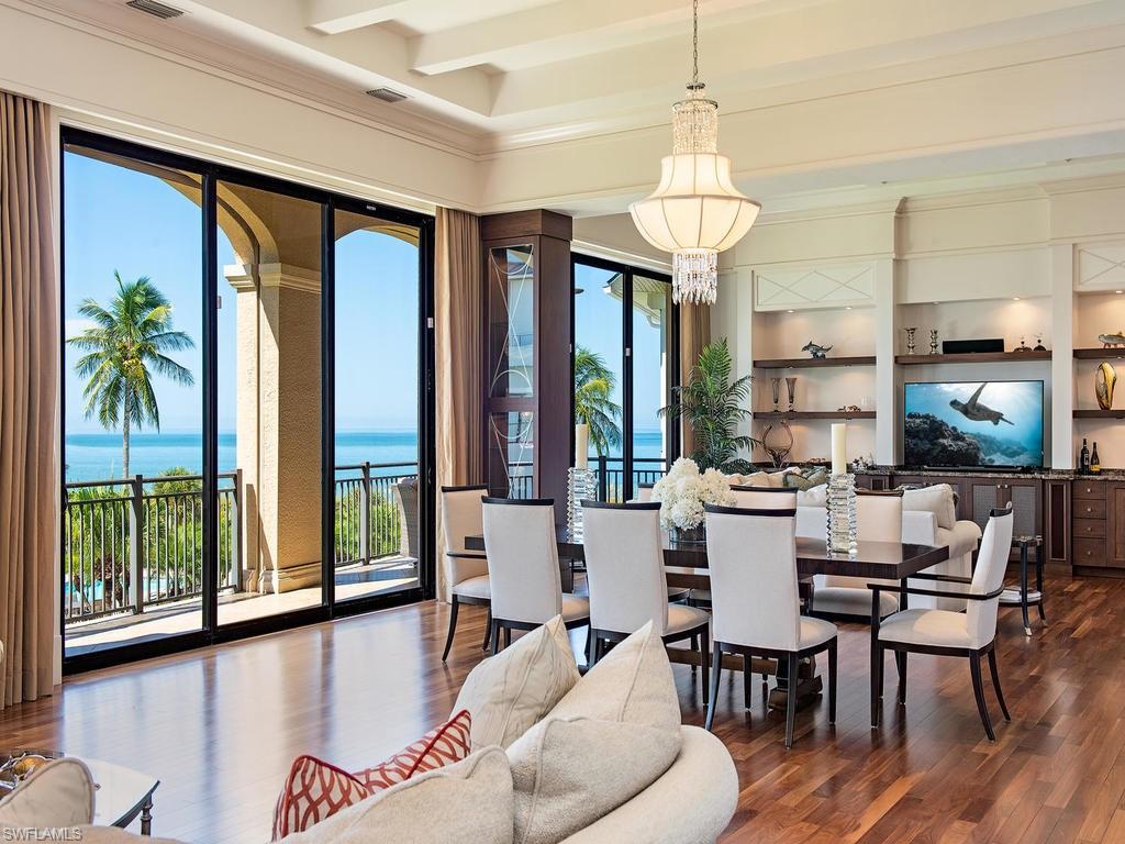 Fabulous 8800+ SF home in prestigious Barefoot Beach. No expense/feature was overlooked in  this 4 level masterpiece by McGarvey custom builders. Gulf views abound from multiple rooms and decks and beach access is only steps away via a private path through the garden and past the private pool shared by only 8 homes. Exquisite craftsmanship is apparent wherever you look; wood/marble/tile  floors, extensive millwork, chefs kitchen with double islands, custom cabinets, gas range and more.  A magnificent Great room concept combines living, dinning and casual family room all with floor to ceiling sliders with Gulf views. Open staircases of rich dark woods contrasted with white trim add drama to every level. Spacious guest suites spread over 3 levels with the entire 4th floor dedicated to the owners retreat with Spa Bath, Media room, large sundeck with glass railings, electric awning and amazing beach and Gulf views. The lower level includes entry foyer, large great room,  guest kitchen opening to private spacious theater,  guest bedroom and office. House includes elevator, multiple refrigeration options including wine tower, electric screens and shutters and 4 bay garage.