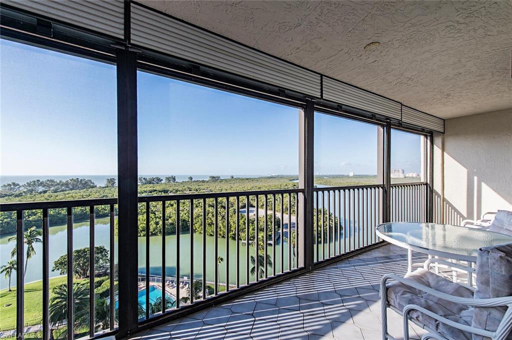 Vanderbilt Beach Area-Top Floor Condo-Walking Distance to the Beach- Gulf of Mexico Views! Enjoy magnificent views of gulf sunsets and the bay from this rarely available top floor condo. This spacious, 2 bedroom, 2 bath unit has been partly renovated with fresh paint, granite counter in master bath, tile countertops in kitchen.  Tastefully furnished for your comfort and vacation enjoyment. Building amenities include a fabulous olympic size pool, tennis courts, party room and an on-site manager/concierge. A short walk to Vanderbilt Beach and Wiggins Pass park and a 5 minute drive to Naples best shopping and dining.