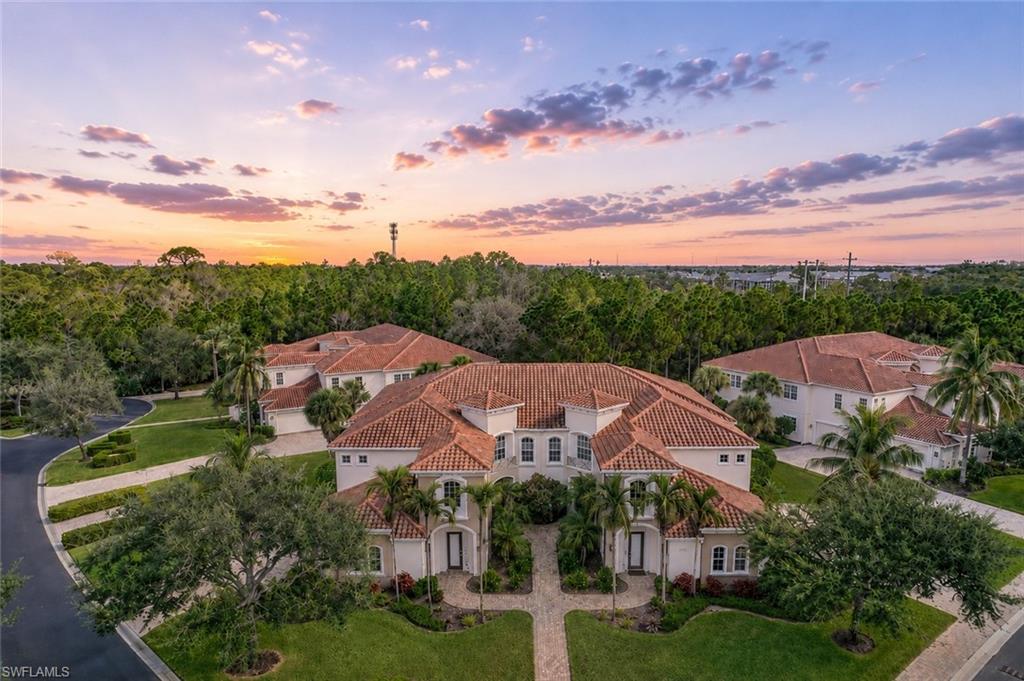 Experience the best of Southwest Florida's bundled golf lifestyle in Vasari Country Club, where golf membership is immediate and included with ownership. More than just a home, this spacious second-floor coach residence offers access to one of the area's most active and welcoming communities, known for its beautifully maintained landscaping, vibrant social calendar, resort-style amenities, and friendly atmosphere where there is always something happening.

A private elevator provides effortless access to this desirable floorplan featuring 3 bedrooms plus a den, an attached two-car garage, and nearly 2,400 square feet of comfortable living space. From the screened lanai, enjoy peaceful views of lush tropical landscaping and natural woodlands, creating a private backdrop for morning coffee or relaxing afternoons.

The thoughtfully designed split-bedroom floorplan offers privacy for owners and guests alike. The spacious primary suite features dual walk-in closets and an oversized bath, while the den with French doors provides flexible space for a home office, media room, or additional guest accommodations. The open kitchen flows seamlessly into the main living area, making entertaining easy and enjoyable.

Life at Vasari revolves around its championship 18-hole golf course and exceptional amenity package, including tennis, bocce, pickleball, resort-style pool and spa, clubhouse dining, social events, and countless opportunities to connect with neighbors and friends. Ideally located near Gulf beaches, downtown Naples, RSW Airport, shopping, dining, and entertainment, this residence offers the perfect combination of golf, lifestyle, and location.