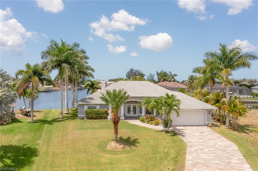 Welcome to your Western exposure waterfront paradise home located on interesting canals of Rococco & Horseshoe. You will enjoy the spectacular sunsets over the basin from your own backyard oasis. When you enter your immaculate home through the double doors, you're greeted with an amazing view of the water & salt water solar-heated pool with full automation. The home has an open floor plan with split bedrooms (4 bedrooms) including 2 masters, 3 full baths including a pool bath. The oversized pool deck allows for an abundance of entertaining. The kitchen features granite counter tops, breakfast bar plus 2 dining areas and stainless-steel appliances. Other upgrades: tray ceilings, reverse water osmosis system through entire home. AC unit is 3-years old. You will fall in love instantly; so, don’t wait.