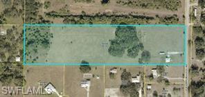 A beautiful setting in need of a new home!! This almost a 10 acre parcel has plenty of room to raise horses or have cattle. The trees... there is  a mixture of Oaks and Palms with a fair amount of the land cleared. The property has been fenced and cross fenced in the front 5 acres allowing the 3 head of cow to graze over several pastures. There is a 900 sq ft workshop built of block construction with hurricane rated windows and doors. 
There is a pond on the property. A perfect spot to build a new home and you can choose the exact location.
County owned property across the street and to the North(right) of the property.