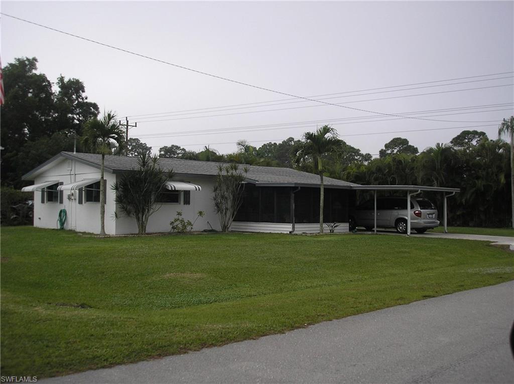 This is a clean neat two bedroom, one & half bath home with outside shower too.  There are three enclosed screened porches for your entertaining.  Clam Shell type shutters.  This is a real home and  it  priced right.