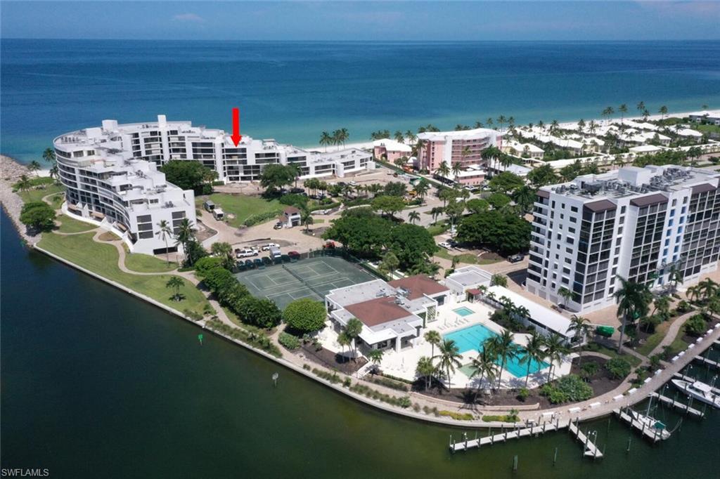 LOCATION! LOCATION!! LOCATION!! FRESHLY PAINTED!!! Best hidden gem in the Moorings!!! Absolutely beautiful condo offers 3 spacious (en-suite) bedrooms and 3.5 baths. Property was updated in 2015 and it is front and center on the Gulf right "on the beach". The unobstructed views from this 5th floor condo are unrivaled and most definitely inspiring. Every night you will enjoy a mind-blowing sunset and a different light show. You may never leave your massive balcony. Additionally, the 3 zone Sonos System as well as the AC unit can be controlled from you phone. Kitchen has beautiful granite counter tops, marble backsplash and gorgeous porcelain floors that extend into entry and other areas of the Condo. This Condo has an open functional floor plan, electrically controlled shades in the living room and dining room as well as all new closet systems in Master and front Guest room. Complex has 2 pools (for beautiful Sunrises and Sunsets), 2 club houses, Har-Tru tennis courts, State of the Art, fitness center, Bocce Ball Court, Kayak Launch, Boating and much more. Entry is semi private as you share the elevator landing with only one other owner. One parking space under ground and ample parking above garage. Admiralty Point has been completely renovated with grounds that are breathtaking and an Amazing renovated Pool, Grill and Lobby right below the condo!