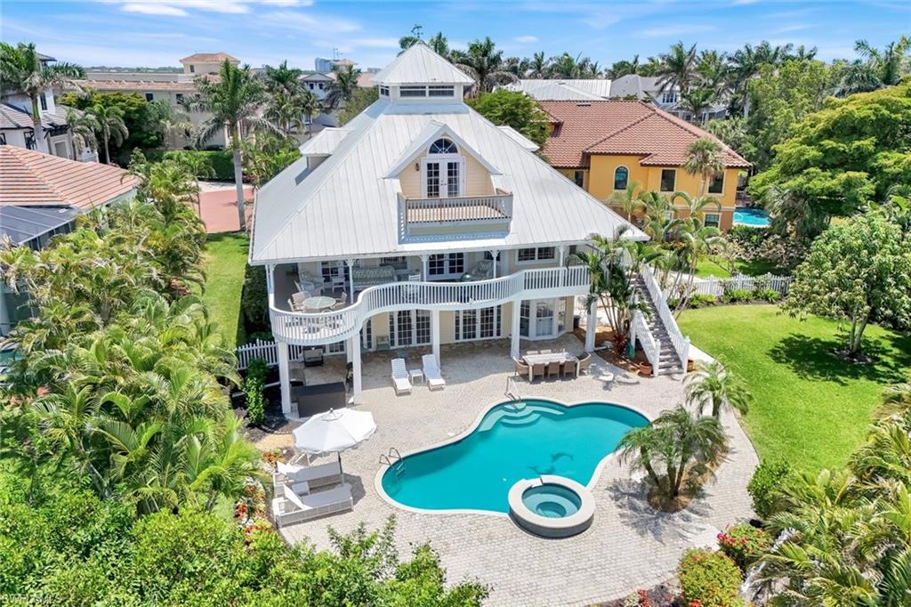 Welcome to Barefoot Beach! Take advantage of the rare opportunity to rent this Old Florida cottage style home in the prestigious development of Barefoot Beach. Located in the gated community of Southport on the Bay, this home offers everything needed to experience one of the finest winter retreats in all of Southwest Florida. Including membership access to The Club at Barefoot Beach Club, a private, full-service, beachfront club. The home itself boasts an incredible amount of both indoor and outdoor living space, affording you the ability to entertain and host family and friends who you wish to share this special experience with. Relax on the home's wrap around deck that's backdropped with phenomenal views of Little Hickory Bay. On the main and upper living areas, there are 3 formal bedrooms and 3 1/2 bathrooms. Located on the lower-level, poolside living area is a fully renovated bonus space capable of serving as a place to gather all of your treasured guests together for endless laughs and memories, as well as a space to cool off after enjoying the beautifully landscaped, fully fenced, sun-drenched pool area. This part of the homes features a full bathroom and multiple queen sized murphy beds, perfect for additional sleeping arrangements for overflow guests. Showcase your cooking prowess with the multitude of outdoor grilling and cooking equipment available for your use. Bring your fishing poles and fish Southwest Florida's famous waters right from the backyard of this home on your private, shade covered boat dock. Don't forget to bring the most cherished, furry family member, as this is a pet-friendly rental property! While you'll feel like you're experiencing a private island oasis, revel in the fact that this property's location keeps you within striking distance to several of Southwest Florida most popular, shopping, dinning, and entertainment hubs, including; Mercato, Downtown Bonita Springs and Coconut Point. When you factor everything mentioned above, it's hard to find a reason to not make this property your paradise retreat!