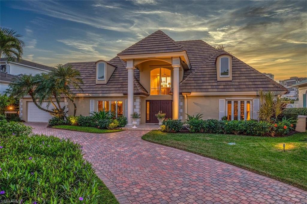 This magnificent waterfront home is located on Venetian Bay - one of the most sought-after areas in beautiful Naples Fl. Imagine taking a boat from the rear of your home to enjoy an evening at the Village on Venetian Bay where you will find upscale shopping and dining. Once in the bay, where dolphin can often be seen playing, enjoy paddle boarding and kayaking or travel out to the Gulf of Mexico where leisurely pursuits such as jet skiing and fishing can be enjoyed.  On return cook your catch al fresco in the well-equipped summer kitchen, and entertain in grand scale on the expansive deck, which is complete with fireplace, or just relax in the heated pool and spa. The home is nestled on a substantial lot on a quiet cul-de-sac in the prestigious Park Shore neighborhood which has its own beach front access with restrooms and picnic tables.  This home boasts an astounding floor plan, with a large entertainment room upstairs overlooking the bay, which could also double as an impressive guest suite.  Major renovations have been made to the home including a new roof in 2018.  With abundant space for entertaining this home has everything you need for the perfect Florida lifestyle.