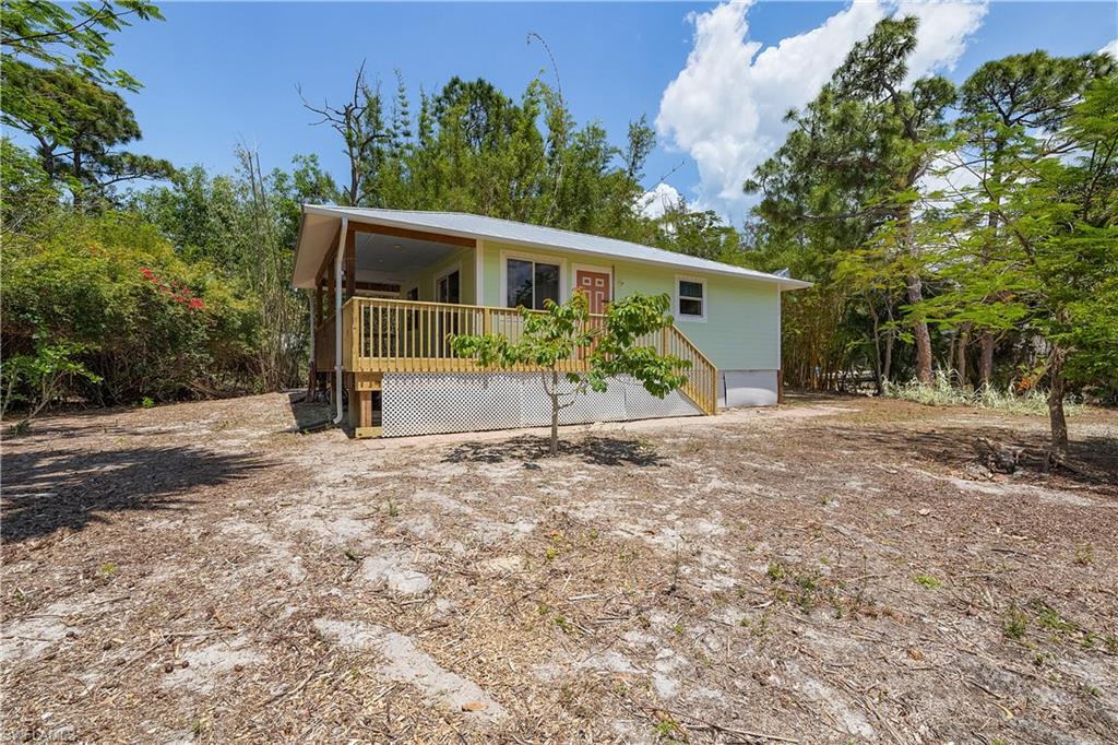 BACK ON THE MARKET- BUYER GOT COLD FEET!

Welcome to your slice of true island living in beautiful Bokeelia. Nestled on a quiet street just minutes from Pineland Marina, this charming coastal cottage offers the laid-back lifestyle Southwest Florida is known for—where fishing days are long, sunsets are unforgettable, and life moves at just the right pace.

This well-maintained home is built for both durability and peace of mind, featuring Hardie siding and a metal roof designed to withstand the elements. The outdoor spaces have been thoughtfully updated with new decking and rails, creating the perfect setting to relax, entertain, or simply take in the coastal breeze.

Inside and out, this property reflects pride of ownership—and notably, the home has never flooded, offering added confidence for seasonal or full-time residents.

Whether you're searching for a personal getaway, a full-time residence, or an income-producing property, this home checks all the boxes. With strong rental potential, proximity to world-class fishing, boating access nearby, and the natural beauty of Pine Island all around, the possibilities here are wide open.

As one of the best-priced single-family homes currently available on the island, this is an exceptional opportunity for buyers looking to get into the market without compromising on location or lifestyle. Opportunities like this are rare in Bokeelia—and this one will not last long.

If you’ve been dreaming of island life—morning coffee by the water, afternoons on the boat, and evenings watching the sky light up over the Gulf—this is your opportunity to make it a reality.