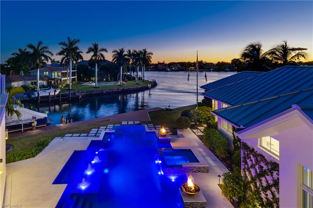 Incomparable best describes this stunning Knauf-Koenig built waterfront home. Offering the best of massive bay views & boat protected canal frontage. Enter custom Mahogany front doors into vaulted living room ceilings & water views from every door/window. Chef's Gourmet kitchen with 2 ovens, a steam oven, Wolf/Sub-Zero appliances, walk-in wine cooler, massive kitchen island, & private Butlers's kitchen. Outdoor living space offers 200 ft of water frontage, 3 boat lifts, a 30 ft GRANDFATHERED cut-in boat slip, custom infinity edge pool, fire pits, beautiful water features, outdoor kitchen & TV lounge area. Built to last w/ 2 floors of solid concrete, 140+ subterranean pilings, & ground to roof rebar support. Floor plan offers 6 bed, fitness room, library/den, fully equipped guest suite, 1st floor master w/ optional 2nd & private elevator. Additional upgrades include State-of-the-art tech Elan home system, 80Kw home Generac generator, & a 1,000 gallon gas propane tank. Highly desirable cul-de-sac low traffic location & minutes to 5th Avenue/beaches. Don't miss your opportunity to reside in one of Naples most sought after waterfront communities Royal Harbor.