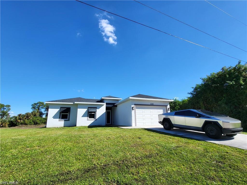 *** WATERFRONT HOME ON CANAL *** EXTRA WIDE VIEW IN BACKYARD COMPARED TO MOST HOMES IN THE NEIGHBORHOOD !! Comes with Buyer Warranty **Stunning Modern Home with tens of thousands in upgrades**! Welcome to luxury living in this meticulously designed modern home nestled in the heart of Buckingham Fort Myers. Step into elegance with pristine white polished floors that exude sophistication and charm throughout the home. - **Designer Kitchen Elements:** The gourmet kitchen features beautiful quartz countertops, designer cabinetry, and top-of-the-line appliances, creating a perfect blend of style and functionality. - **Huge covered Patio with Lights:** Entertain guests or unwind in style on the spacious covered patio, illuminated by enchanting lights, offering a seamless indoor outdoor living experience. - **Luxurious Master en-suite:** Retreat to the opulent master bedroom featuring a luxurious en-suite bathroom complete with a gorgeous freestanding tub, huge shower, and premium fixtures, providing a sanctuary of relaxation. - Enhancing both aesthetics and functionality, decorative shutters, impact windows and doors add a touch of elegance while providing security and peace of mind.- **Prime Location:** Enjoy the convenience of an amazing location offering easy access to amenities, shopping, dining, and entertainment options. - **Finest Materials Used:** Every detail of this home reflects quality craftsmanship and attention to detail, with the finest materials used throughout to ensure lasting beauty and durability. This exceptional residence offers the epitome of luxury living, combining modern elegance with comfort and convenience. Don't miss the opportunity to make this dream home yours. This home has characteristics of a million dollar home with an amazing price! Some photos of the furniture in this listing have been virtually rendered.