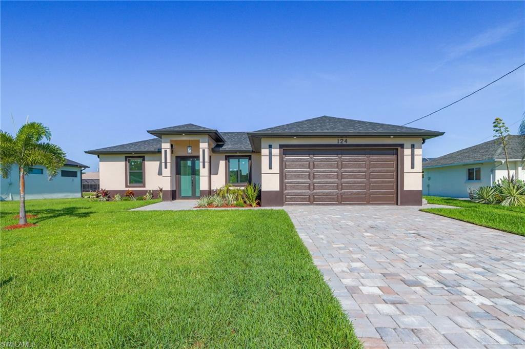 Experience the perfect blend of modern luxury and Florida waterfront living in this stunning brand-new construction home, situated on a beautiful freshwater canal in Cape Coral.
Designed with exceptional attention to detail, this contemporary residence offers 3 bedrooms, 2 bathrooms, and approximately 1,387 square feet under air, featuring an open-concept layout filled with natural light, soaring ceilings, and premium finishes throughout.
A striking modern façade welcomes you with elegant double glass entry doors, professional landscaping, and clean architectural lines that create outstanding curb appeal.
Inside, you’ll find oversized porcelain tile flooring throughout the entire home and a designer kitchen that serves as the centerpiece of the living space. Featuring European-style cabinetry extending to the ceiling, quartz countertops, a large waterfall island, stainless steel appliances, designer lighting, and abundant storage, this kitchen is both beautiful and functional.
The spacious great room opens seamlessly through oversized impact sliding glass doors to the covered lanai, creating the ideal indoor-outdoor lifestyle Southwest Florida is known for.
One of the home’s most impressive features is the fully equipped outdoor kitchen, complete with a built-in grill, sink, beverage refrigerator, storage, and generous prep space—perfect for entertaining family and friends while enjoying peaceful freshwater canal views.
The private owner’s suite offers a luxurious retreat, while the additional bedrooms provide flexibility for guests, family, or a home office.

Property Highlights

Brand-new construction
Freshwater canal lot
3 Bedrooms | 2 Bathrooms
Approximately 1,387 SF under air
Impact-resistant windows and doors
Large-format porcelain tile throughout
Quartz countertops throughout the home
European-style cabinetry
Waterfall kitchen island
Stainless steel appliances
Covered lanai
Fully equipped outdoor kitchen
Spacious 2-car garage
Professionally landscaped yard with irrigation
Beautiful waterfront setting with spectacular Florida sunsets and colorful evening skies

Conveniently located near shopping, dining, golf courses, parks, schools, boat ramps, and the best of Southwest Florida, this move-in-ready home combines sophisticated design, exceptional craftsmanship, and the relaxed waterfront lifestyle buyers are searching for.

Don’t miss the opportunity to own this exceptional new construction home. Schedule your private showing today!