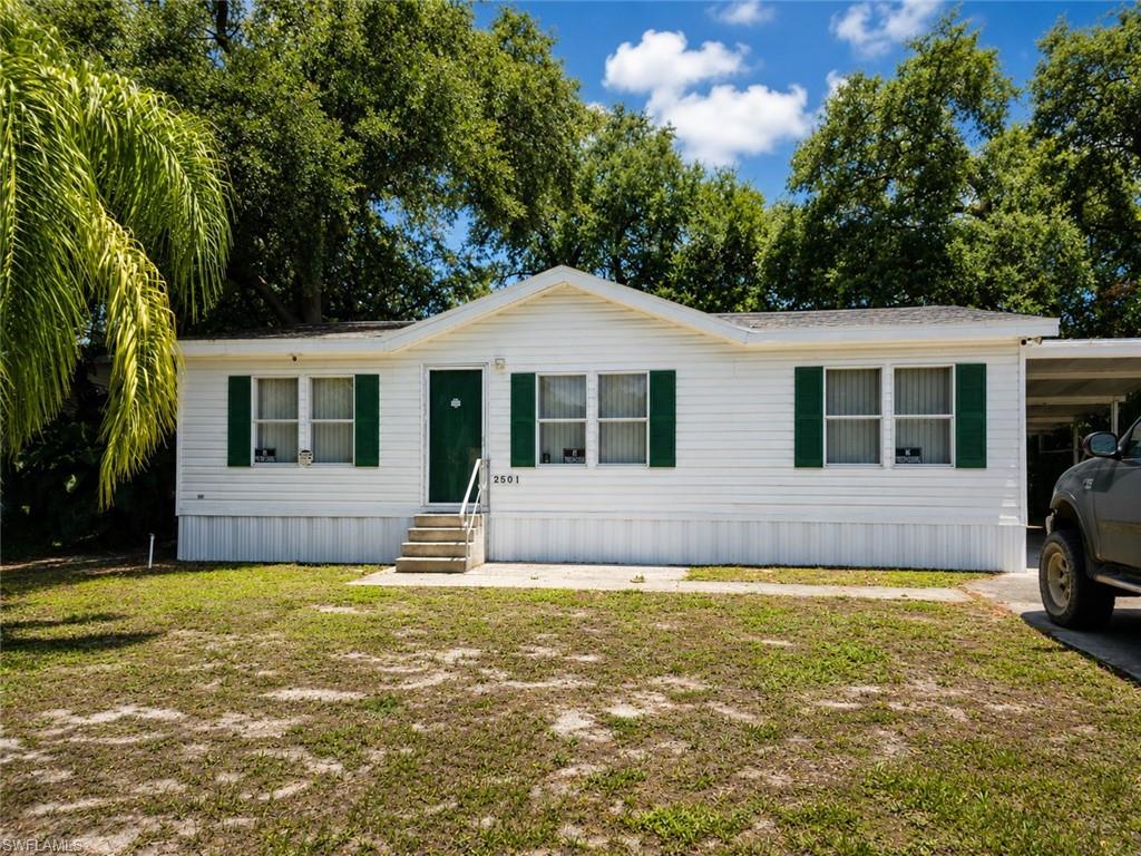 Welcome to 2501 Gail Helen Ct in North Fort Myers! This well-maintained 3-bedroom, 2-bath manufactured home offers comfortable living with the added benefit of owning your land—no land lease required. Located in a desirable community close to Bayshore Rd with an incredibly low HOA fee of just $78 per month, this property provides exceptional value and affordability. Inside, you'll find a spacious layout designed for everyday living, including an updated walk-in shower in the primary bathroom that adds a modern touch. Outside, the home features a large covered carport with plenty of space for parking, along with a backyard storage shed that's perfect for tools, hobbies, or additional storage. Whether you're looking for a full-time residence, seasonal retreat, or an affordable Florida home, this property checks all the boxes. Conveniently located near shopping, dining, golf courses, and Southwest Florida's beautiful beaches, this is an opportunity you won't want to miss.